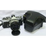 Olympus OM-1 with 50mm F1.8 lens with ER case and accessories. P&P Group 2 (£18+VAT for the first