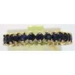 9ct gold sapphire full eternity ring, size K/L, 1.8g. P&P Group 1 (£14+VAT for the first lot and £