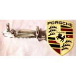 Cast aluminium Porsche coat hanger in shape of a key, L: 29 cm. P&P Group 1 (£14+VAT for the first