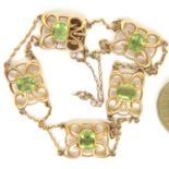 Art Nouveau 15ct gold and peridot bracelet with safety chain, L: 19 cm, 11.5g. Clasp fully