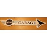 Cast iron Mini Garage arrow shop sign, L: 50 cm. P&P Group 1 (£14+VAT for the first lot and £1+VAT