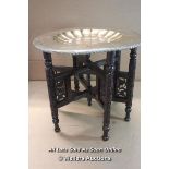 *INDIAN ROSEWOOD CARVED FOLDING SIDE TABLE WITH DISHED BRASS TRAY / 39CM HIGH, TRAY 44CM WIDE [