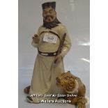 A CHINESE SHIWAN STYLE MUD MEN FIGURE OF A MAN WITH A TIGER AT HIS FEET, 30CM HIGH