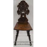 *19TH CENTURY ITALIAN RENAISSANCE INFLUENCED BLACK FOREST HALL CHAIR WITH GROTESQUE AND ACANTHUS