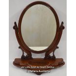 *VICTORIAN MAHOGANY DRESSING MIRROR, HAVING AN OVAL MIRROR IN CARVED SUPPORTS TERMINATING IN THE