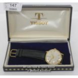 GENTS TISSOT SEASTAR SEVEN,MECHANICAL MOVEMENT,SILVER ARABIC BATTON DIAL,YELLOW METAL CASE,LEATHER