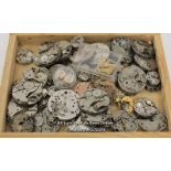 BOX OF MIXED LADIES AND GENTS WATCH MOVEMENTS FOR SPARES AND REPAIRS,BULOVA,NIVADA,ROMAN,MOERIS,