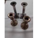 TWO PAIRS OF SILVER PLATED CANDLESTICKS