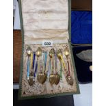 A BOXED SET OF TWELVE SILVER GILT AND EN