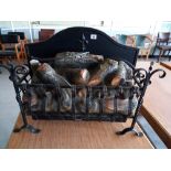 An wrought Iron basket with electric log effect
