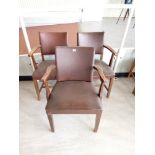 Three faux leather backed elbow chairs