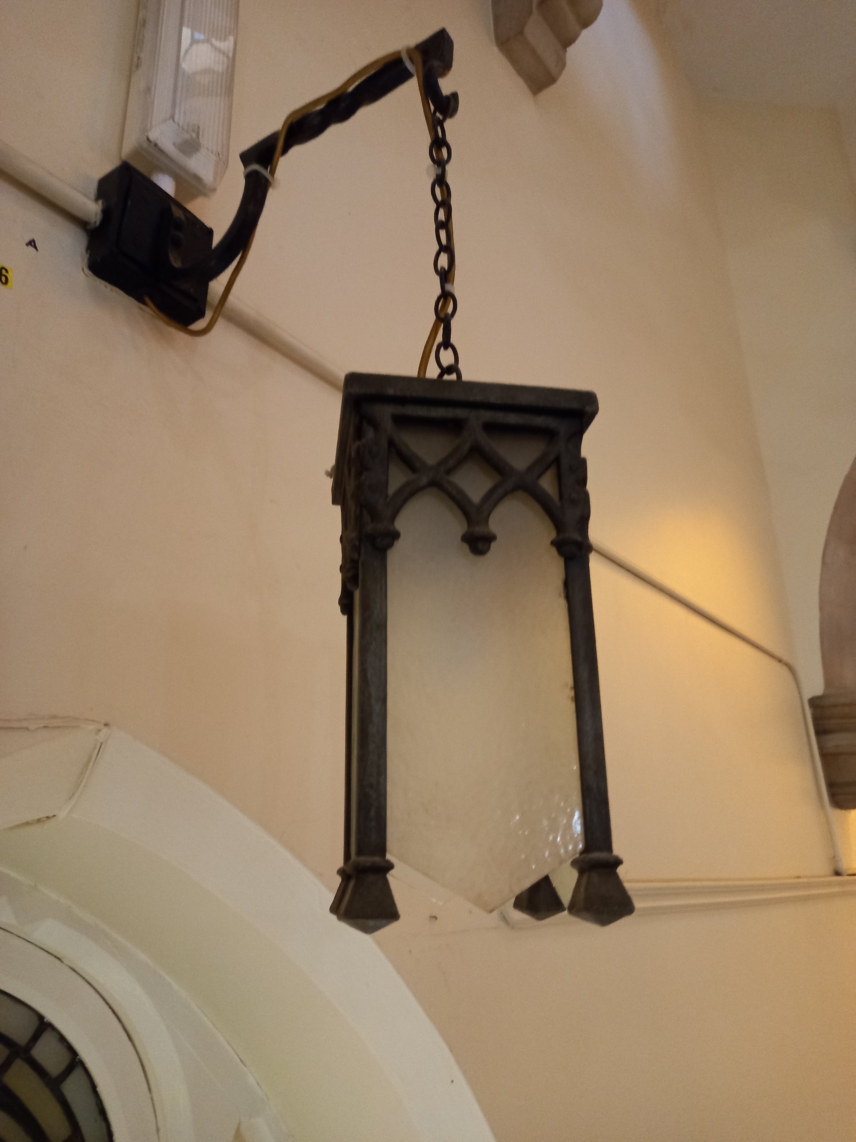 A 1920s metal and glass gothic style hanging wall light