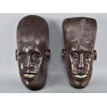 Paar afrikanische Masken, wohl Makonde, Ebenholz