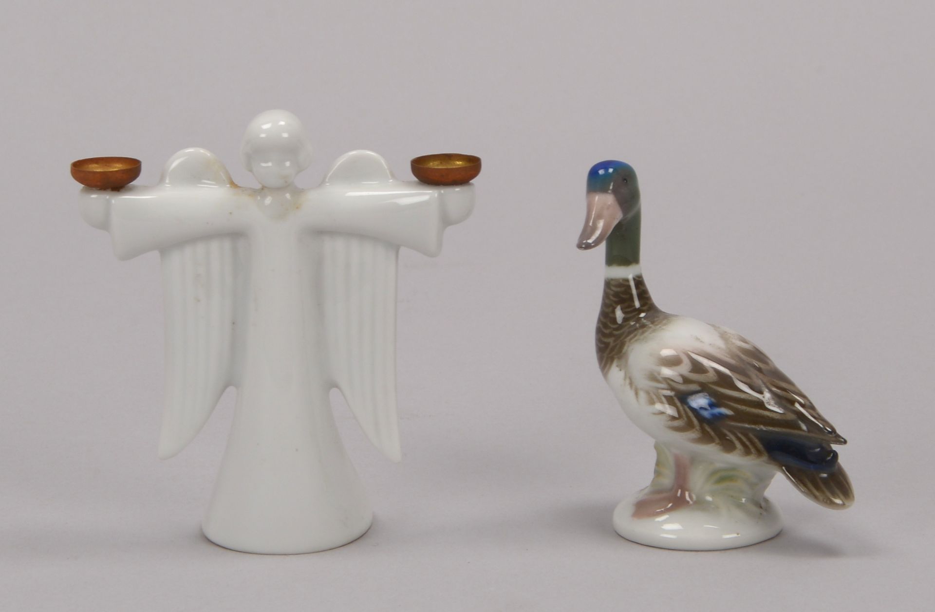 Rosenthal, 2 Porzellanteile: 1 Figur, -Ente-, Hoehe 7,5 cm, und 1 figuerlicher Kerzenhalter, -Engel-