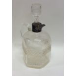 A silver mounted cut glass liqueur bottle. Cheste