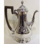 A tall George II silver coffee pot of baluster for