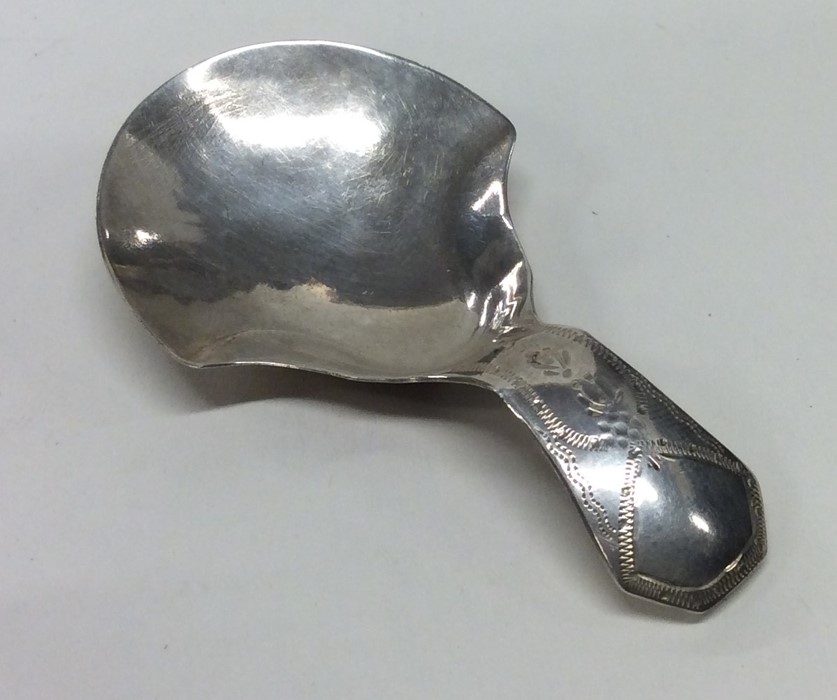 A good Georgian silver engraved caddy spoon. Birmi
