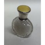 A silver and yellow enamelled cylindrical scent bo