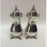 A pair of Edwardian silver peppers. Birmingham. Ap