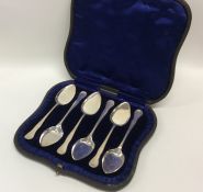 A cased set of six silver ice cream spoons with sh