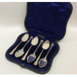 A cased set of six silver ice cream spoons with sh