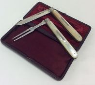 A rare MOP travelling knife and fork contained wit