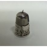 A novelty silver thimble mounted with a castle. Ap