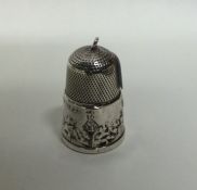 A novelty silver thimble mounted with a castle. Ap