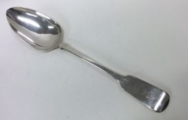 EXETER: A large fiddle pattern silver basting spoo