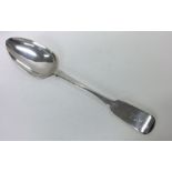 EXETER: A large fiddle pattern silver basting spoo