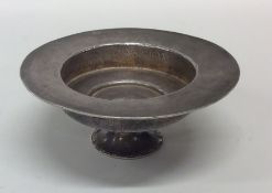 An early English engraved silver dish of chinoiser