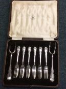 A cased set of silver plated pickle forks. Est. £2