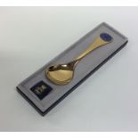 GEORG JENSEN: A silver gilt preserve spoon in fitt