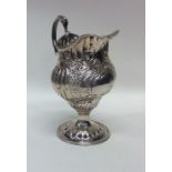 A George III silver cream jug of baluster form. Ap