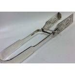 A pair of large fiddle pattern silver asparagus to