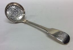 A fiddle pattern silver sifter spoon. London. By G