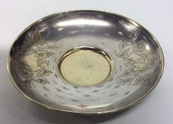 A Russian silver salver decorated with flowers and