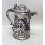 A good heavy chased silver lidded tankard profusel