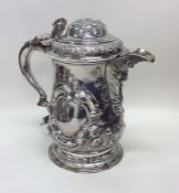 A good heavy chased silver lidded tankard profusel