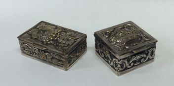 Two rectangular chased boxes with hinged lids. Est