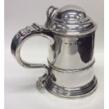 A good Georgian silver dome top lidded tankard on