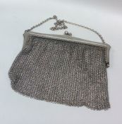 A heavy silver purse on suspension chain. Birmingh