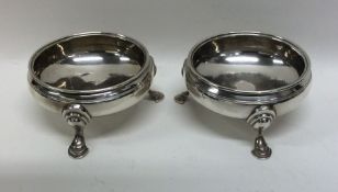 A pair of Georgian silver circular salts. London.