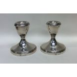 A pair of tapering silver dwarf candlesticks. Birm