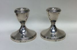A pair of tapering silver dwarf candlesticks. Birm