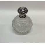 A silver mounted hobnail cut scent bottle with gil