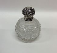 A silver mounted hobnail cut scent bottle with gil