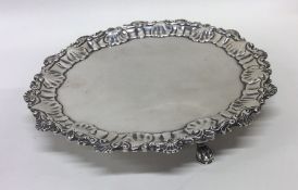 A fine quality circular silver salver with shaped
