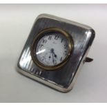 A good square engine turned silver mounted clock w
