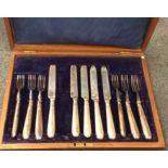 A cased set of six (plus five) silver handled kniv